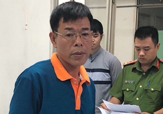 Ông Nguyễn Hải Nam nghe đọc lệnh bắt tạm giam.