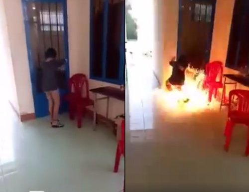Nữ sinh ch&acirc;m lửa đốt ngay trước cửa ph&ograve;ng y tế của trường. Ảnh cắt từ clip.