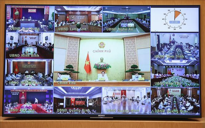 Các địa phương tham dự Phiên họp Chính phủ thường kỳ tháng 9 theo hình thức trực tuyến. Ảnh: Dương Giang/TTXVN.