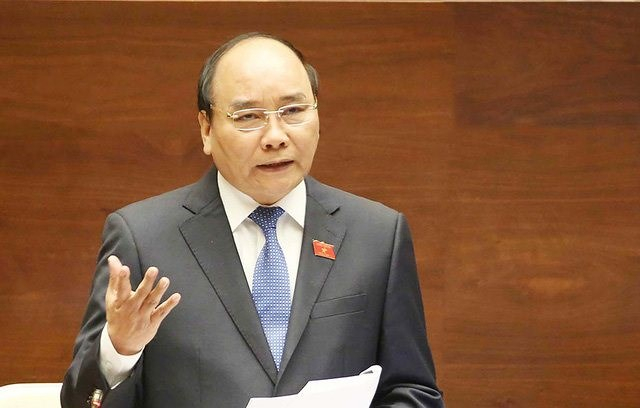 Thủ tướng Nguyễn Xu&acirc;n Ph&uacute;c tại phi&ecirc;n trả lời chất vấn trước Quốc hội gần đ&acirc;y.