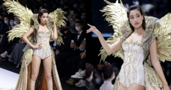 Đỗ Mỹ Linh diện váy 40kg, làm vedette show thời trang